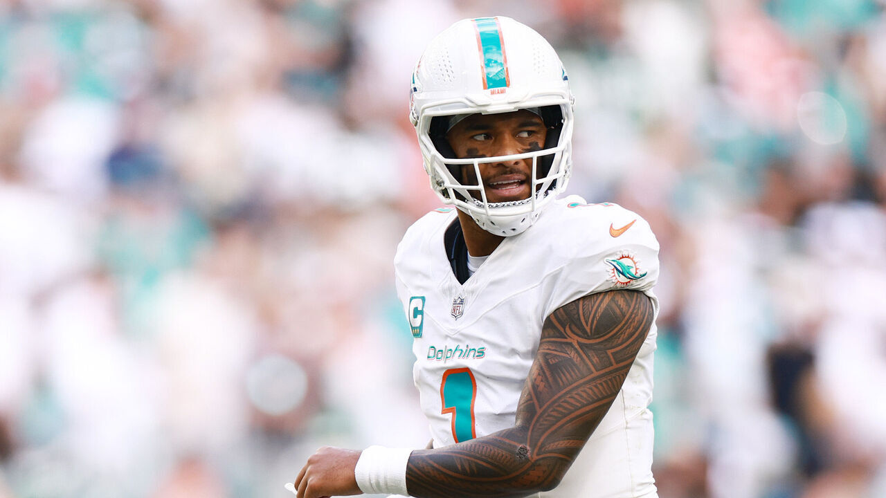 MIAMI GARDENS, FLORIDA - DECEMBER 08: Tua Tagovailoa #1 of the Miami Dolphins reacts to a play during overtime of a game against the New York Jets at Hard Rock Stadium on December 08, 2024 in Miami Gardens, Florida.