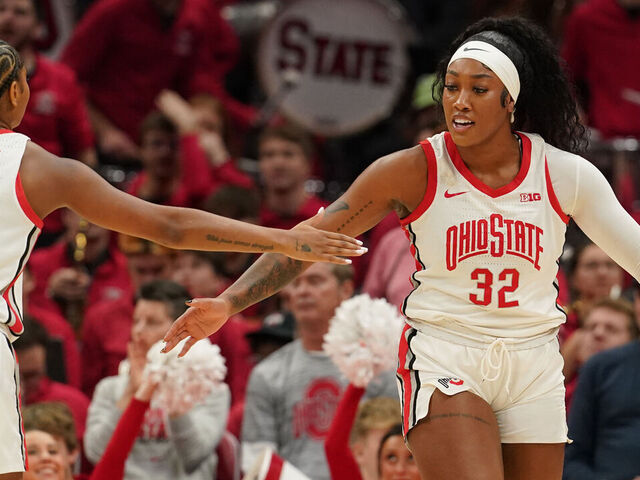 COLUMBUS, OH - DECEMBER 08: Ohio State Buckeyes forward Cotie McMahon (32) celebrates a play with Ohio State Buckeyes guard Chance Gray (21) during the first half of the game between the Ohio State Buckeyes and the Illinois Fighting Illini at Value City Arena in Columbus, Ohio On December 8, 2024.