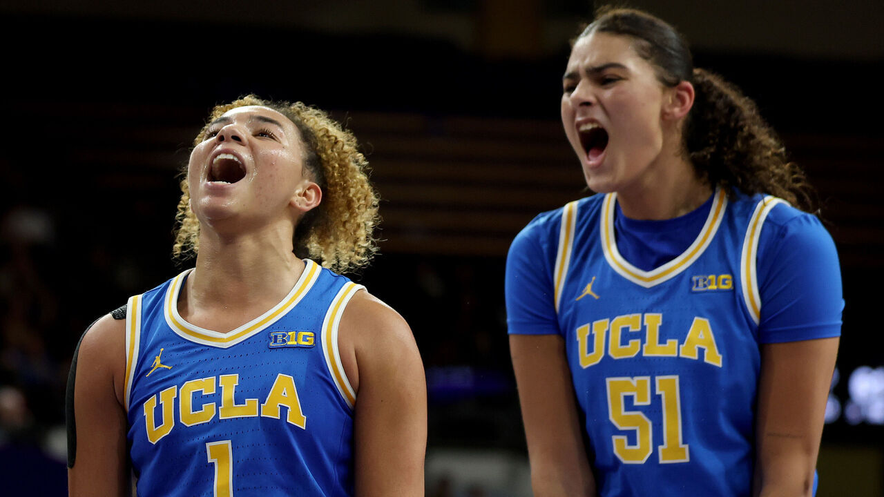 SEATTLE, WASHINGTON - DECEMBER 08: Kiki Rice #1 and Lauren Betts #51 of the UCLA Bruins react during the second half against the Washington Huskies at Alaska Airlines Arena on December 08, 2024 in Seattle, Washington.