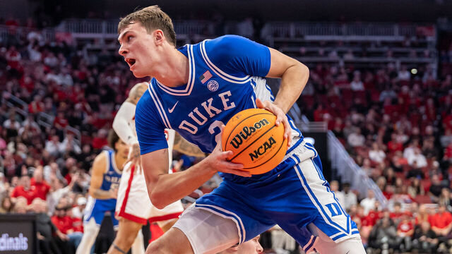LOUISVILLE, KENTUCKY - DECEMBER 08: Cooper Flagg #2 of the Duke Blue Devils drives to the basket during the second half against the Louisville Cardinals at KFC YUM! Center on December 8, 2024 in Louisville, Kentucky.