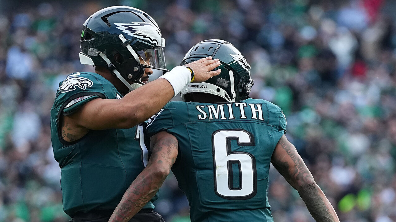 PHILADELPHIA, PENNSYLVANIA - DECEMBER 08: DeVonta Smith #6 of the Philadelphia Eagles celebrates his touchdown with teammate Jalen Hurts #1 as they play the Carolina Panthers in the second quarter at Lincoln Financial Field on December 08, 2024 in Philadelphia, Pennsylvania.