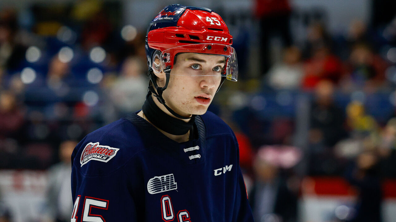 SAGINAW, MI - DECEMBER 7: Beckett Sennecke #45 of Oshawa looks on before a faceoff during a game between Oshawa Generals and Saginaw Spirit at Dow Event Center on December 7, 2024 in Saginaw, Michigan.