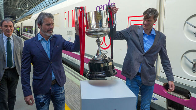 SEVILLE, ANDALUSIA, SPAIN - APRIL 04: Former soccer players Rafael Alkorta (l) and Leo Franco (r), on their arrival with the cup, on April 4, 2024, in Seville, Andalusia, Spain. Ex-footballers Rafael Alkorta (left), representing Athletic Club, and Leo Franco (right), representing Mallorca, take the Copa del Rey trophy to Seville from Madrid in an AVE high-speed train, which will be played this Saturday in the Andalusian capital.