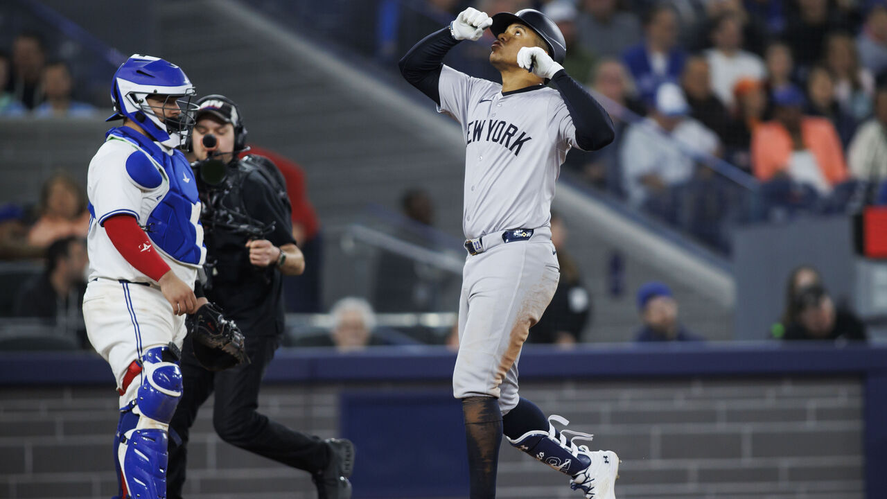 TORONTO, CANADA - APRIL 17: Juan Soto #22 of the New York Yankees crosses the plate as he hits a solo home run in the eighth inning of their MLB game against the Toronto Blue Jays at Rogers Centre on April 17, 2024 in Toronto, Canada.