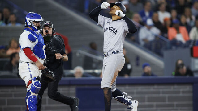 TORONTO, CANADA - APRIL 17: Juan Soto #22 of the New York Yankees crosses the plate as he hits a solo home run in the eighth inning of their MLB game against the Toronto Blue Jays at Rogers Centre on April 17, 2024 in Toronto, Canada.