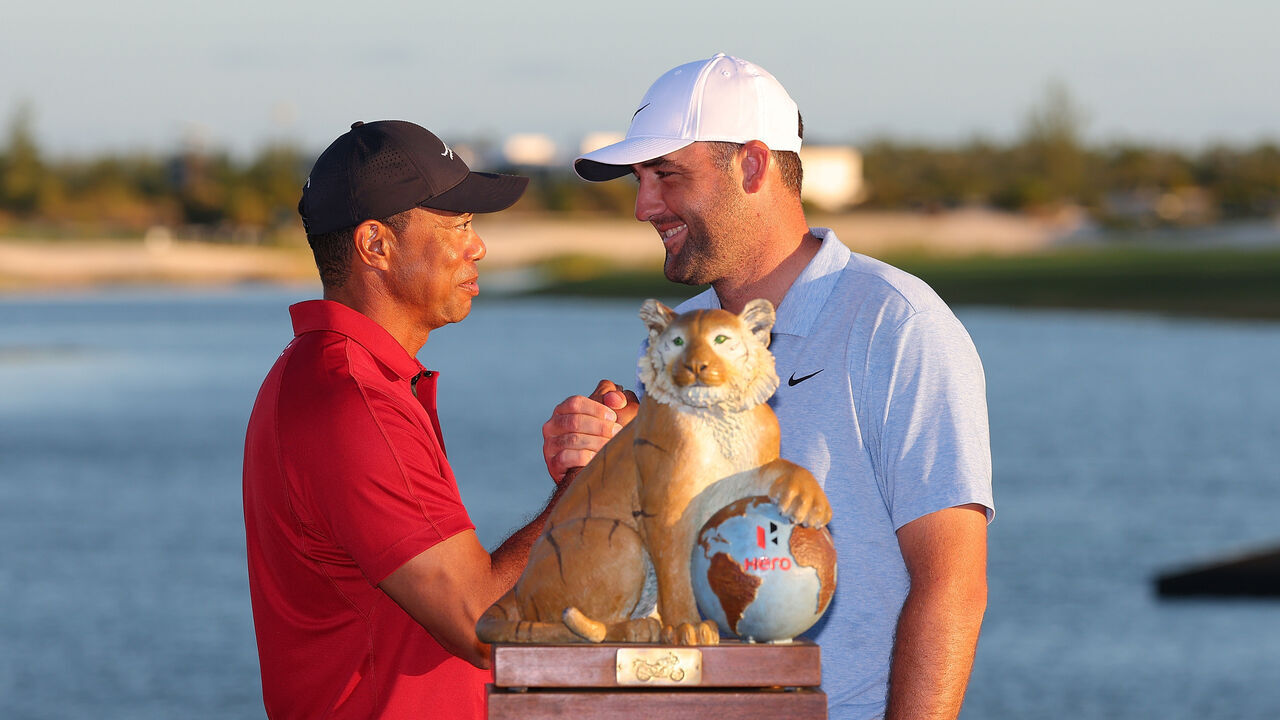 NASSAU, BAHAMAS - DECEMBER 08: Tiger Woods of the United States congratulates Scottie Scheffler of the United States after the final round of the Hero World Challenge 2024 at Albany Golf Course on December 08, 2024 in Nassau, Bahamas.