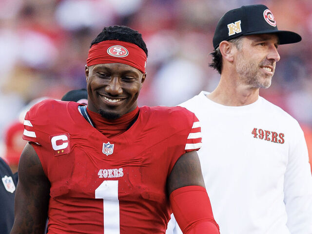 SANTA CLARA, CALIFORNIA - DECEMBER 8: Wide receiver Deebo Samuel Sr. #1 of the San Francisco 49ers interacts with head coach Kyle Shanahan during the first half of an NFL football game against the Chicago Bears, at Levi's Stadium on December 8, 2024 in Santa Clara, California.