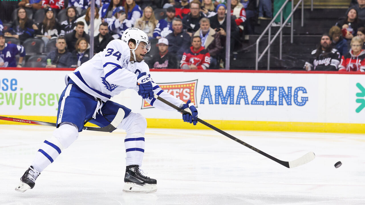 NEWARK, NJ - DECEMBER 10: Toronto Maple Leafs center Auston Matthews (34) takes a shot during a NHL game between the Toronto Maple Leafs and New Jersey Devils at Prudential Center on December 10, 2024 in Newark, New Jersey.