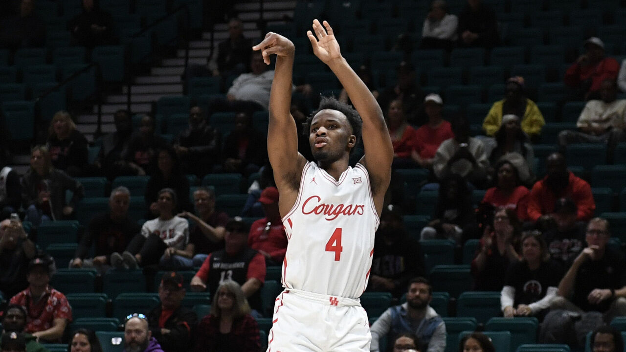 LAS VEGAS, NEVADA - NOVEMBER 30: L.J. Cryer #4 of the Houston Cougars takes a shot against the San Diego State Aztecs in the first half of their game during the Players Era Festival basketball tournament at MGM Grand Garden Arena on November 30, 2024 in Las Vegas, Nevada. The Aztecs defeated the Cougars 73-70 in overtime.