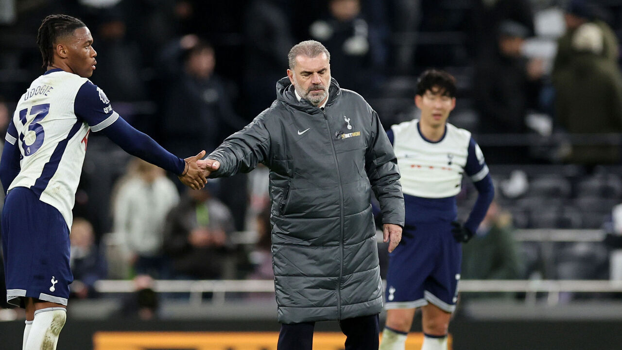 LONDON, ENGLAND - DECEMBER 08: Ange Postecoglou manager / head coach of Tottenham Hotspur with Destiny Udogie of Tottenham Hotspur after the Premier League match between Tottenham Hotspur FC and Chelsea FC at Tottenham Hotspur Stadium on December 08, 2024 in London, England.