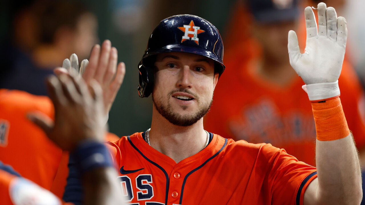 HOUSTON, TEXAS - SEPTEMBER 20: Kyle Tucker #30 of the Houston Astros is congratulated in the dugout after hitting a solo home run in the sixth inning against the Los Angeles Angels at Minute Maid Park on September 20, 2024 in Houston, Texas.