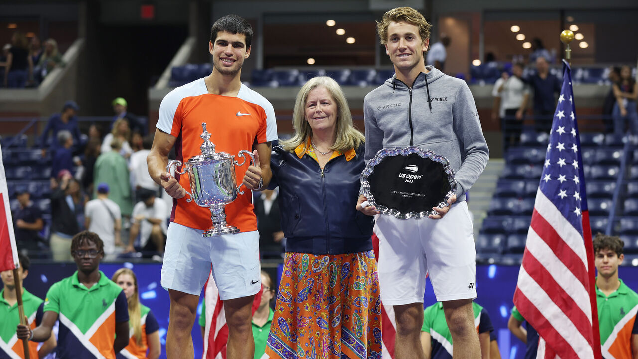 NEW YORK, NEW YORK - SEPTEMBER 11: Carlos Alcaraz of Spain, USTA Chief Executive Stacey Allaster, and Casper Ruud of Norway pose with their trophies after their Men’s Singles Final match on Day Fourteen of the 2022 US Open at USTA Billie Jean King National Tennis Center on September 11, 2022 in the Flushing neighborhood of the Queens borough of New York City.