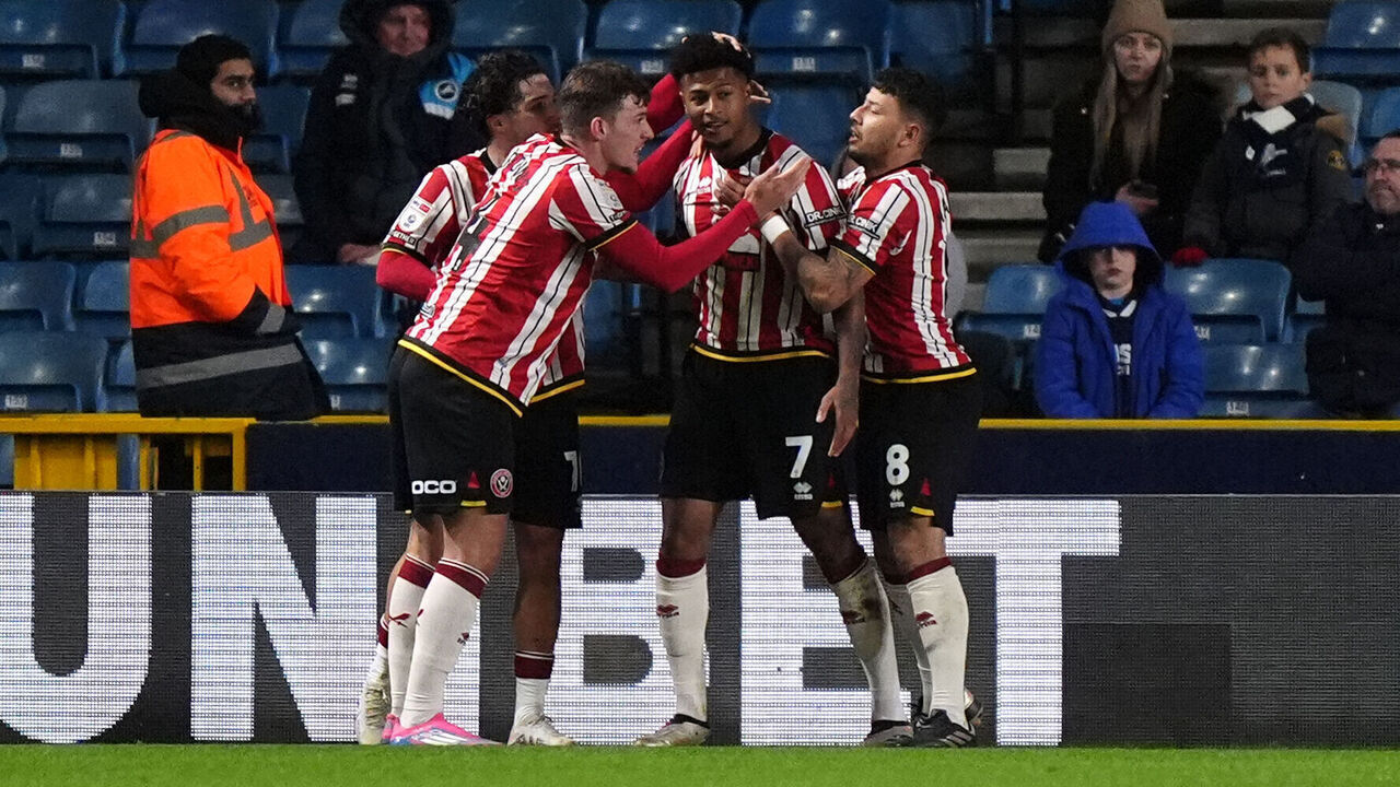 Sheffield United's Rhian Brewster (centre right) celebrates scoring their side's first goal of the game during the Sky Bet Championship match at The Den, London. Picture date: Wednesday December 11, 2024.