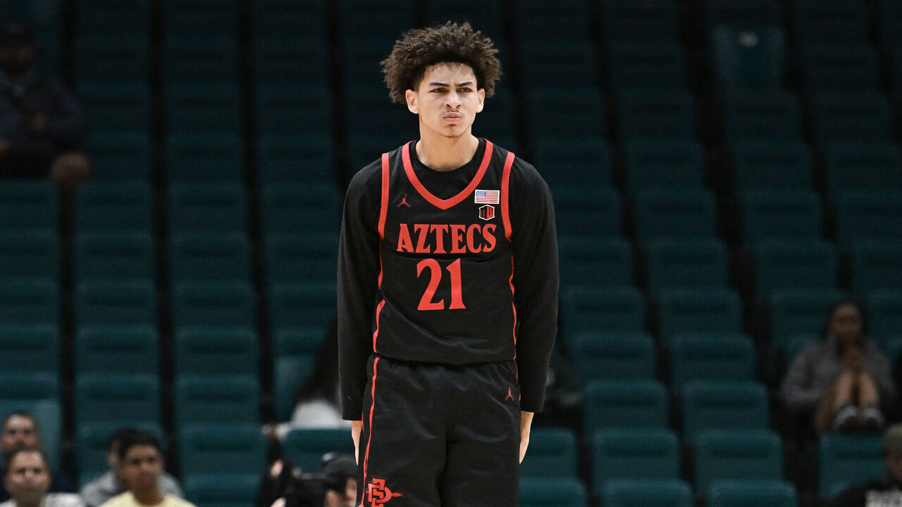 LAS VEGAS, NEVADA - NOVEMBER 30: Miles Byrd #21 of the San Diego State Aztecs reacts to scoring on the Houston Cougars in the second half of their game during the Players Era Festival basketball tournament at MGM Grand Garden Arena on November 30, 2024 in Las Vegas, Nevada. The Aztecs defeated the Cougars 73-70 in overtime.