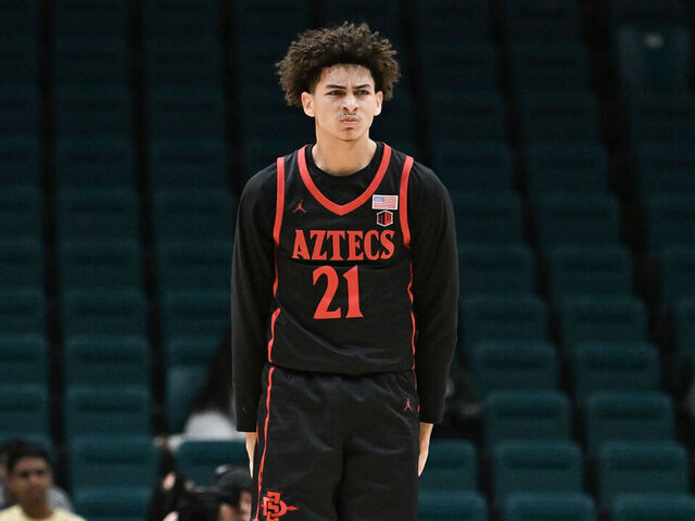 LAS VEGAS, NEVADA - NOVEMBER 30: Miles Byrd #21 of the San Diego State Aztecs reacts to scoring on the Houston Cougars in the second half of their game during the Players Era Festival basketball tournament at MGM Grand Garden Arena on November 30, 2024 in Las Vegas, Nevada. The Aztecs defeated the Cougars 73-70 in overtime.
