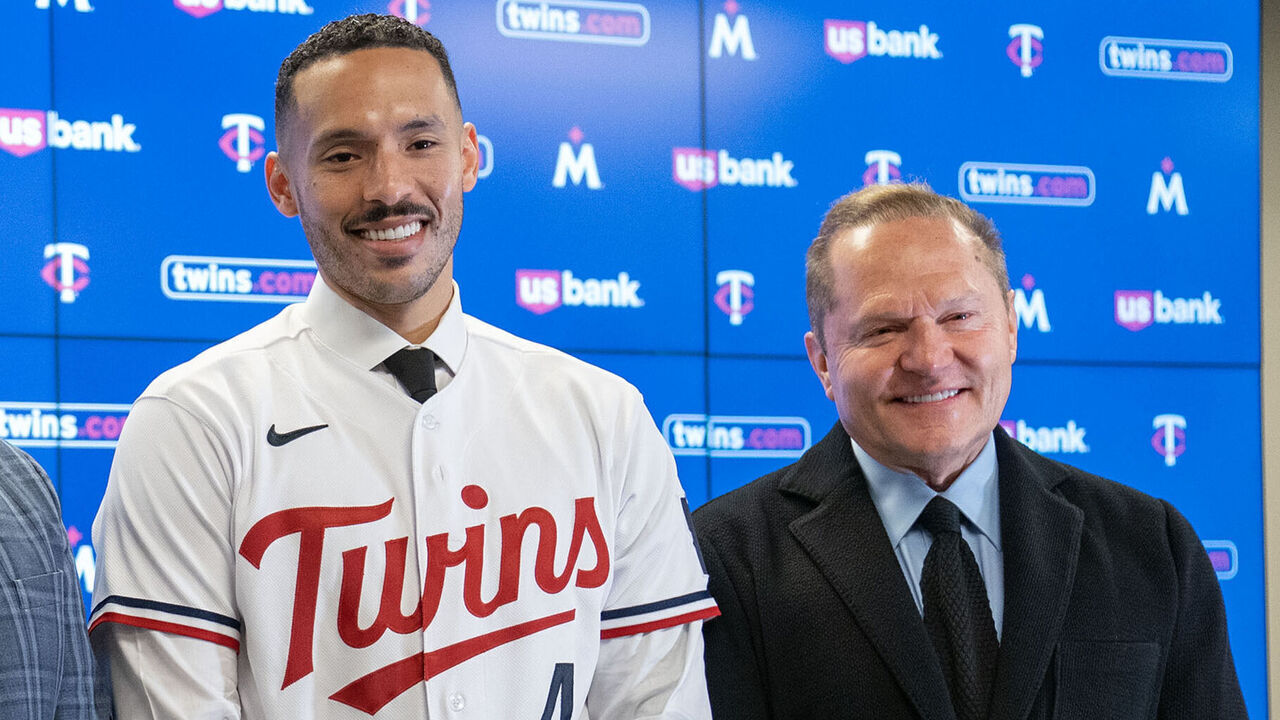 MINNEAPOLIS, MN. - JANUARY 2023: Joe Pohlad, Minnesota Twins executive chair, Derek Falvey, President of Baseball Operations, Carlos Correa, shortstop, and Scott Boras, Correa's agent, left to right, pose for a photo after a press conference to announce Correa's re-signing Wednesday, January 11, 2023 at Target Field in Minneapolis, Minn.