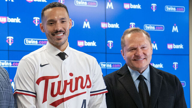 MINNEAPOLIS, MN. - JANUARY 2023: Joe Pohlad, Minnesota Twins executive chair, Derek Falvey, President of Baseball Operations, Carlos Correa, shortstop, and Scott Boras, Correa's agent, left to right, pose for a photo after a press conference to announce Correa's re-signing Wednesday, January 11, 2023 at Target Field in Minneapolis, Minn.
