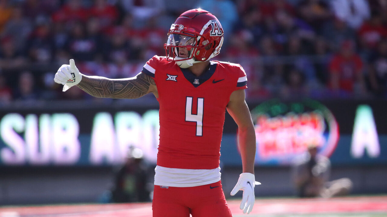 TUCSON, ARIZONA - NOVEMBER 30: Wide receiver Tetairoa McMillan #4 of the University of Arizona Wildcats checks with the referee to make sure that the offense is on the line during the first half of the University of Arizona Wildcats versus the Arizona State Sun Devils football game at Arizona Stadium on November 30, 2024 in Tucson, Arizona.