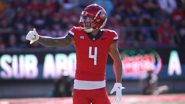 TUCSON, ARIZONA - NOVEMBER 30: Wide receiver Tetairoa McMillan #4 of the University of Arizona Wildcats checks with the referee to make sure that the offense is on the line during the first half of the University of Arizona Wildcats versus the Arizona State Sun Devils football game at Arizona Stadium on November 30, 2024 in Tucson, Arizona.
