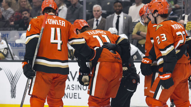 ANAHEIM, CA - DECEMBER 4: Trevor Zegras #11 of the Anaheim Ducks gets helped off the ice after an injury during the game against the Vegas Golden Knights on December 4, 2024 at Honda Center in Anaheim, California.
