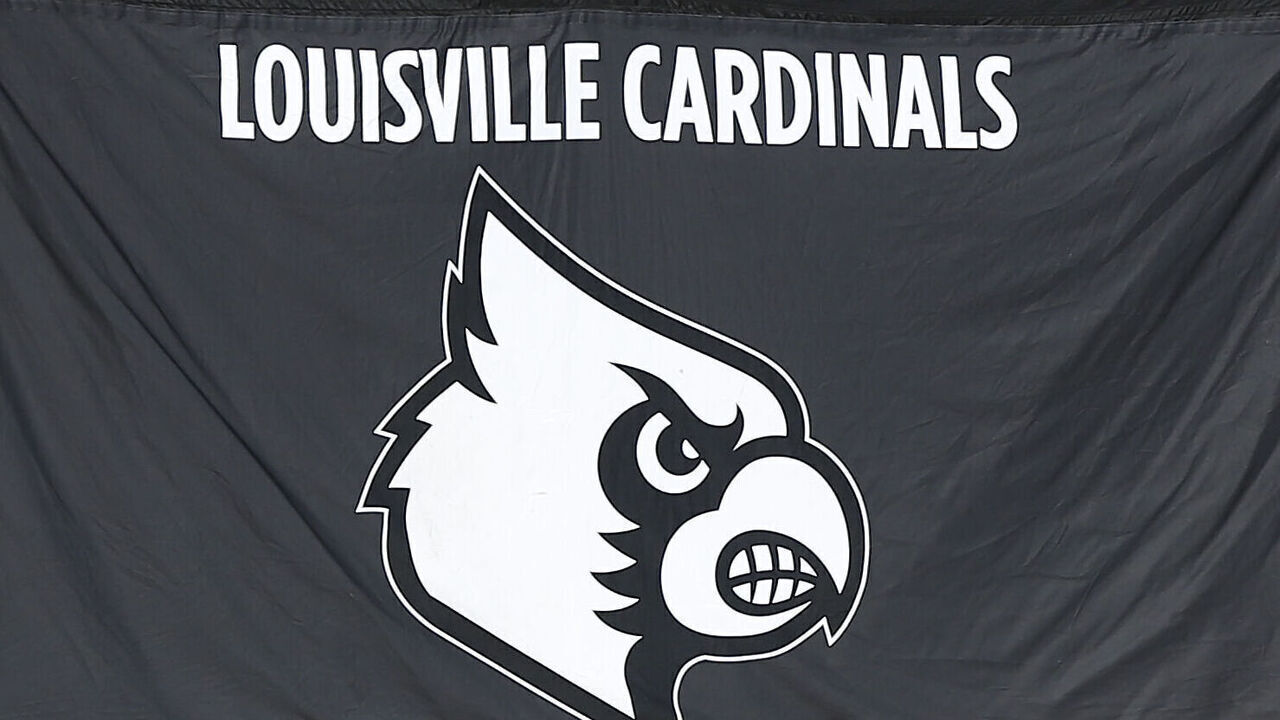CHARLOTTESVILLE, VA - OCTOBER 12: Louisville Cardinals logo on the sidelines during a college football game between the Louisville Cardinals and the Virginia Cavaliers on October 12, 2024, at Scott Stadium in Charlottesville, VA.