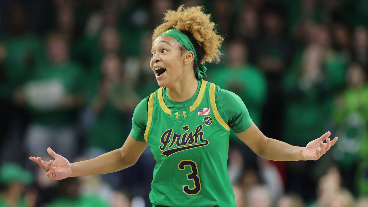 SOUTH BEND, INDIANA - DECEMBER 12: Hannah Hidalgo #3 of the Notre Dame Fighting Irish celebrates a three pointer by Liatu King #20 (not pictured) against the UConn Huskies during the first half at Purcell Pavilion at the Joyce Center on December 12, 2024 in South Bend, Indiana.