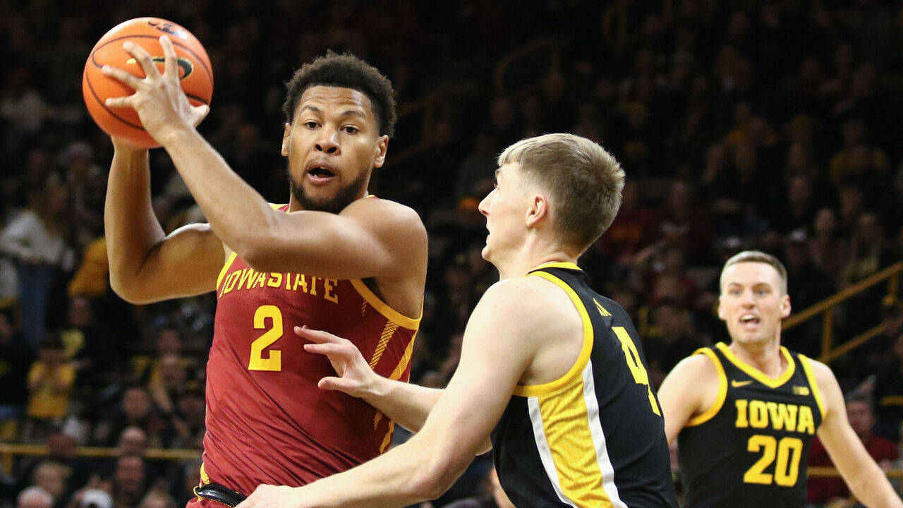 IOWA CITY, IOWA- DECEMBER 12: Forward Joshua Jefferson #2 of the Iowa State Cyclones goes to the basket during the first half against guard Josh Dix #4 of the Iowa Hawkeyes, at Carver-Hawkeye Arena on December 12, 2024 in Iowa City, Iowa.