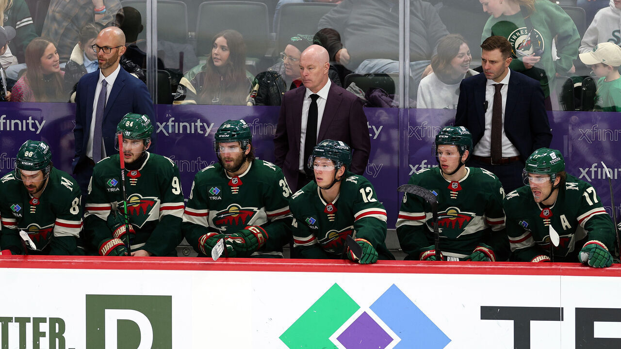 ST PAUL, MINNESOTA - DECEMBER 12: Head coach John Hynes of the Minnesota Wild (C) looks on against the Edmonton Oilers in the third period at Xcel Energy Center on December 12, 2024 in St Paul, Minnesota. The Oilers defeated the Wild 7-1.