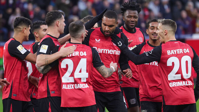 LEVERKUSEN, GERMANY - DECEMBER 7: (LR) Teammates of Bayer Leverkusen celebrate the teams second goal of Jonathan Tah of Bayer Leverkusen during the Bundesliga match between Bayer 04 Leverkusen and FC St. Pauli 1910 at BayArena on December 7, 2024 in Leverkusen, Germany.