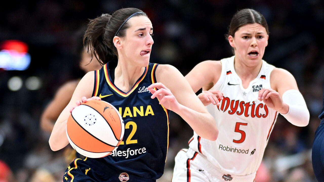 WASHINGTON, DC - SEPTEMBER 19: Caitlin Clark #22 of the Indiana Fever handles the ball against Jade Melbourne #5 of the Washington Mystics at Capital One Arena on September 19, 2024 in Washington, DC.