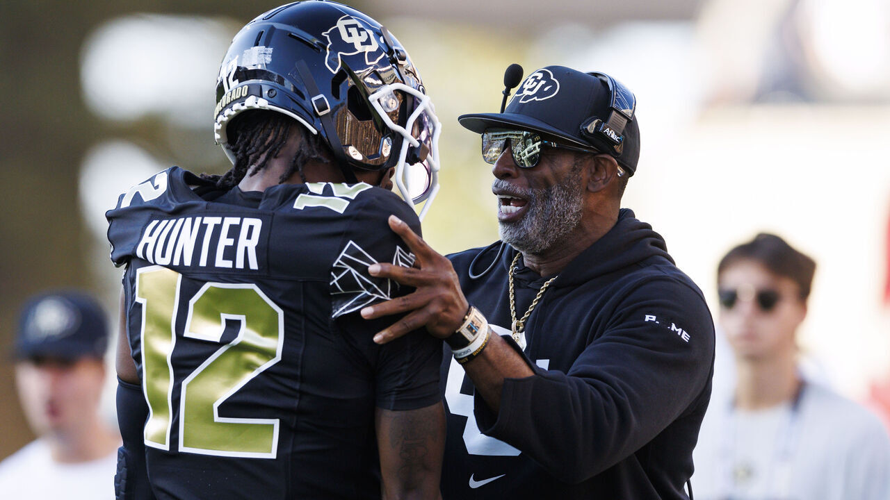 BOULDER, COLORADO - AUGUST 29: Deion Sanders of the Colorado Buffaloes and Travis Hunter #12 of the Colorado Buffaloes on the sideline during a game against North Dakota State Bison at Folsom Field on August 29, 2024 in Boulder, Colorado.
