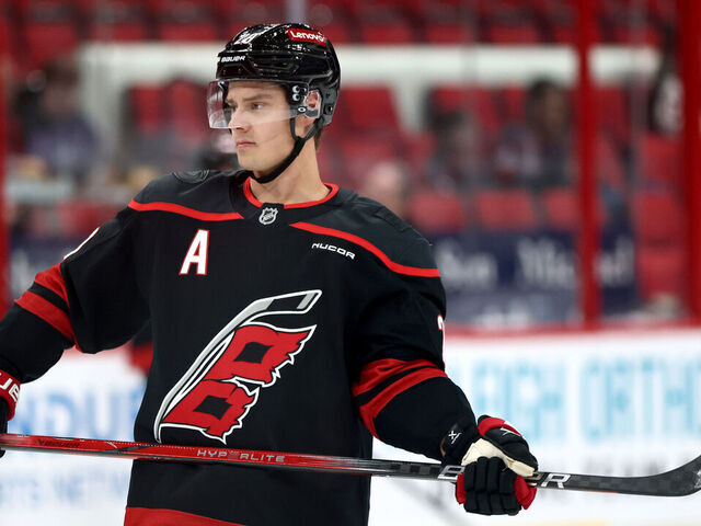 RALEIGH, NORTH CAROLINA - DECEMBER 13: Sebastian Aho #20 of the Carolina Hurricanes looks on prior to the game against the Ottawa Senators at Lenovo Center on December 13, 2024 in Raleigh, North Carolina.