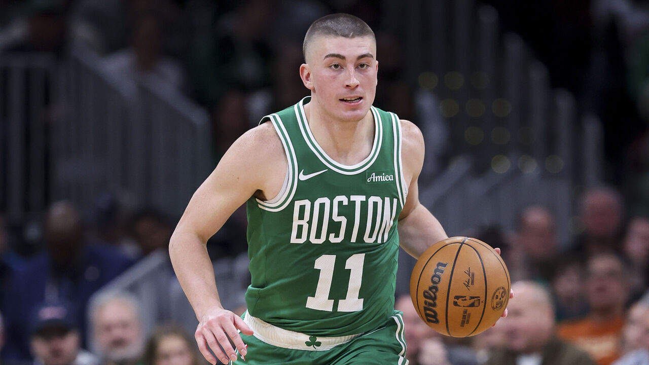 BOSTON, MA - DECEMBER 12: Payton Pritchard #11 of the Boston Celtics dribbles the ball during a game against the Detroit Pistons at TD Garden on December 12, 2024 in Boston, Massachusetts.