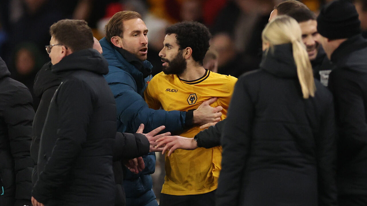 WOLVERHAMPTON, ENGLAND - DECEMBER 14: Craig Dawson of Wolverhampton Wanderers restrains Rayan Ait-Nouri of Wolverhampton Wanderers as tempers flare after the Premier League match between Wolverhampton Wanderers FC and Ipswich Town FC at Molineux on December 14, 2024 in Wolverhampton, England.