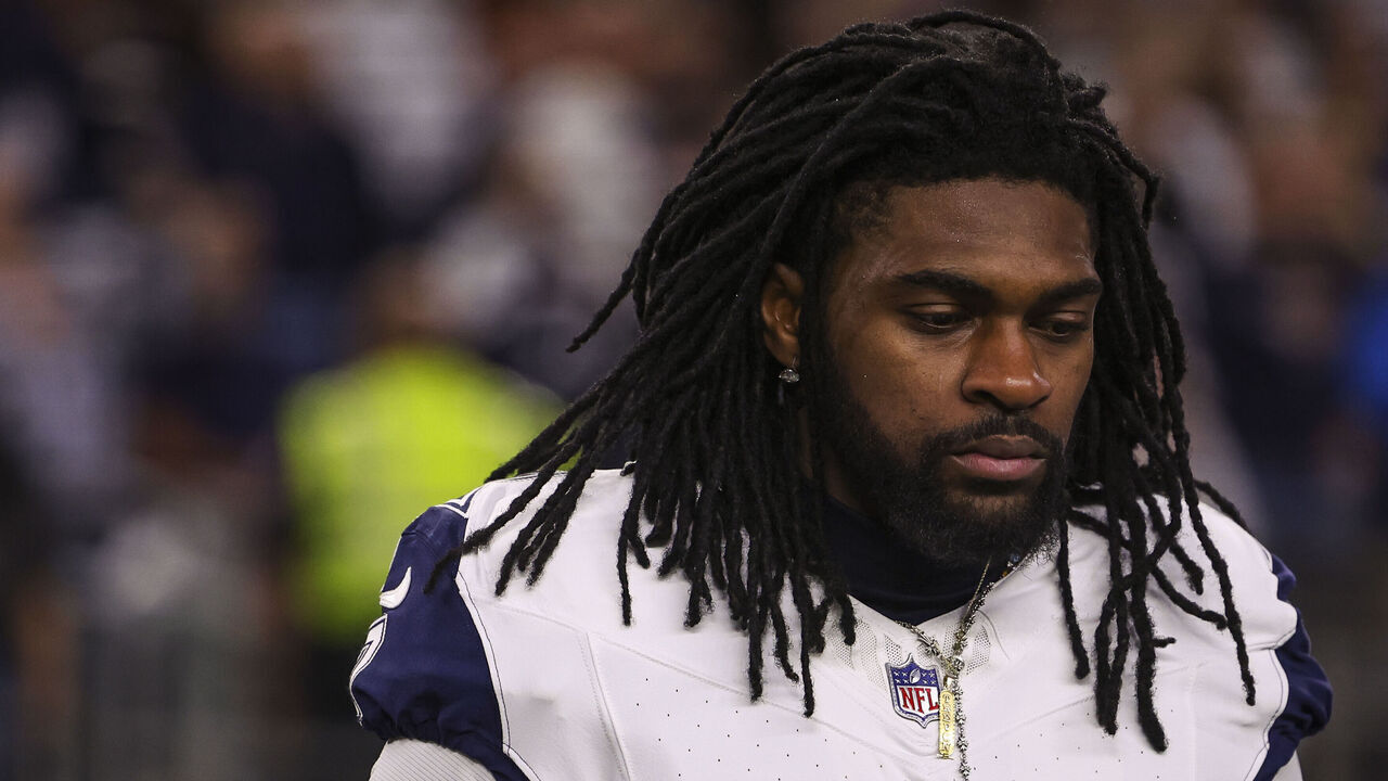 ARLINGTON, TEXAS - DECEMBER 09: Trevon Diggs #7 of the Dallas Cowboys looks on from the sideline during the national anthem prior to an NFL football game against the Cincinnati Bengals at AT&T Stadium on December 9, 2024 in Arlington, Texas.