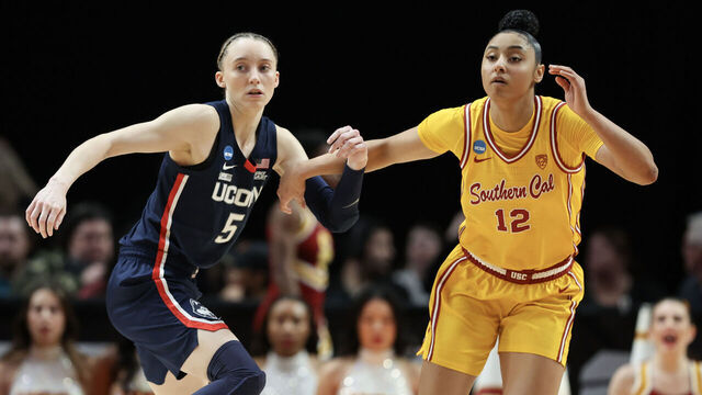 PORTLAND, OREGON - APRIL 01: Paige Bueckers #5 of the Connecticut Huskies defends JuJu Watkins #12 of the USC Trojans during the second half in the Elite 8 round of the NCAA Women's Basketball Tournament at Moda Center on April 01, 2024 in Portland, Oregon.