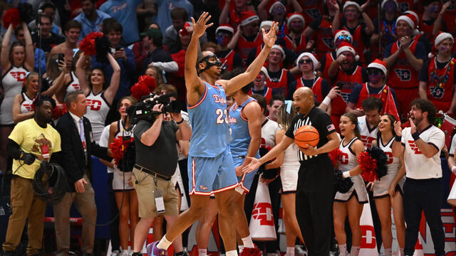 DAYTON, OHIO - DECEMBER 14: Zed Key #23 of the Dayton Flyers pumps up the crowd during the second half of a game against the Marquette Golden Eagles at UD Arena on December 14, 2024 in Dayton, Ohio.