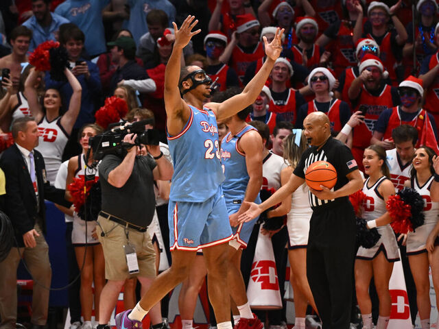DAYTON, OHIO - DECEMBER 14: Zed Key #23 of the Dayton Flyers pumps up the crowd during the second half of a game against the Marquette Golden Eagles at UD Arena on December 14, 2024 in Dayton, Ohio.