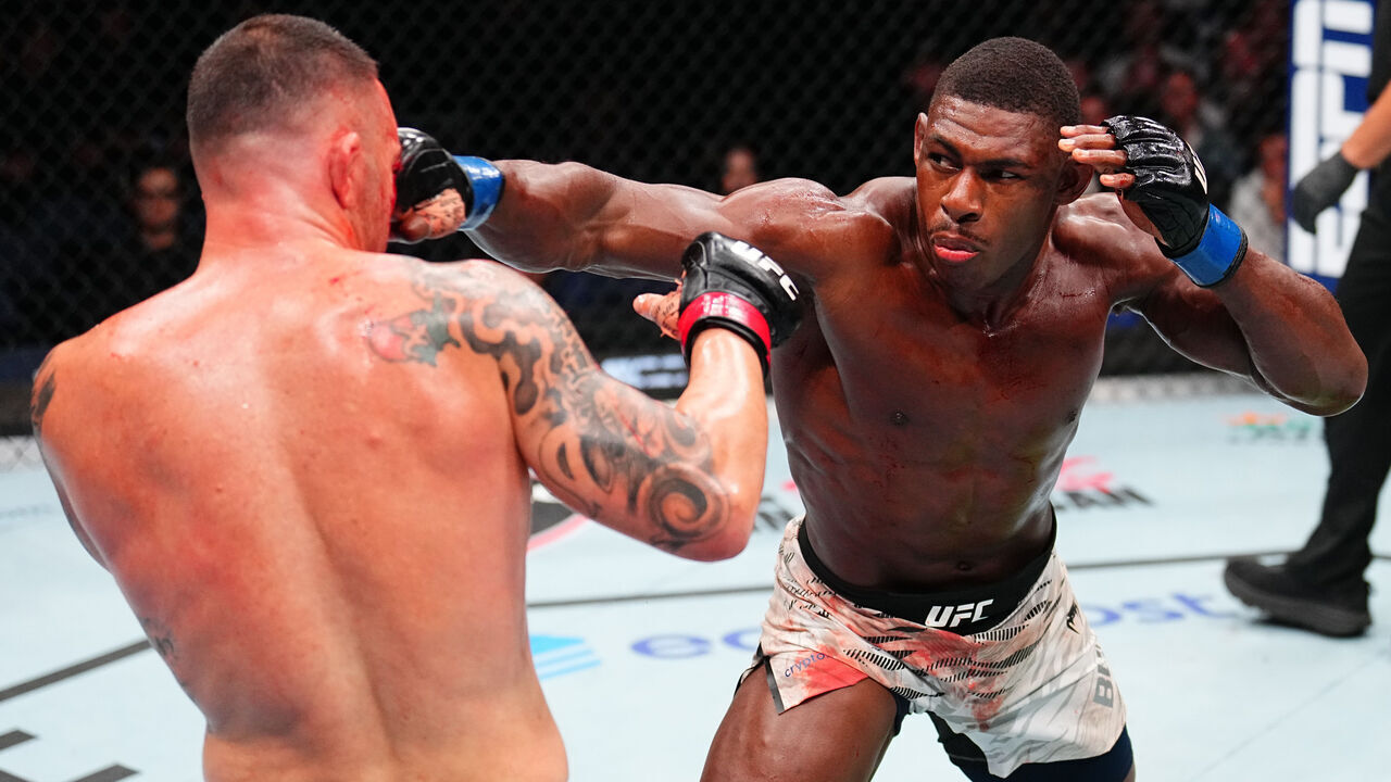 TAMPA, FLORIDA - DECEMBER 14: (R-L) Joaquin Buckley punches Colby Covington in a welterweight fight during the UFC Fight Night event at Amalie Arena on December 14, 2024 in Tampa, Florida.