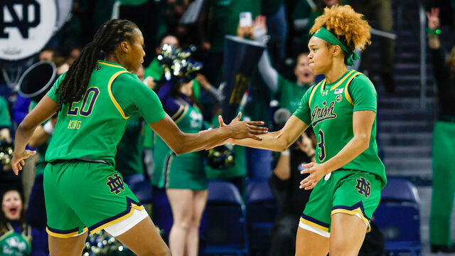 SOUTH BEND, IN - DECEMBER 12: Liatu King #20 and Hannah Hidalgo #3 of Notre Dame are fired up after a three pointer during a game between Connecticut and Notre Dame at Purcell Pavillion at the Joyce Center on December 12, 2024 in South Bend, Indiana.