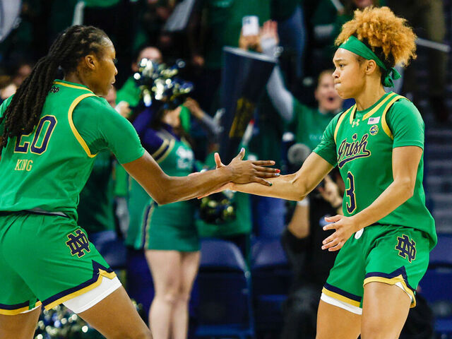 SOUTH BEND, IN - DECEMBER 12: Liatu King #20 and Hannah Hidalgo #3 of Notre Dame are fired up after a three pointer during a game between Connecticut and Notre Dame at Purcell Pavillion at the Joyce Center on December 12, 2024 in South Bend, Indiana.