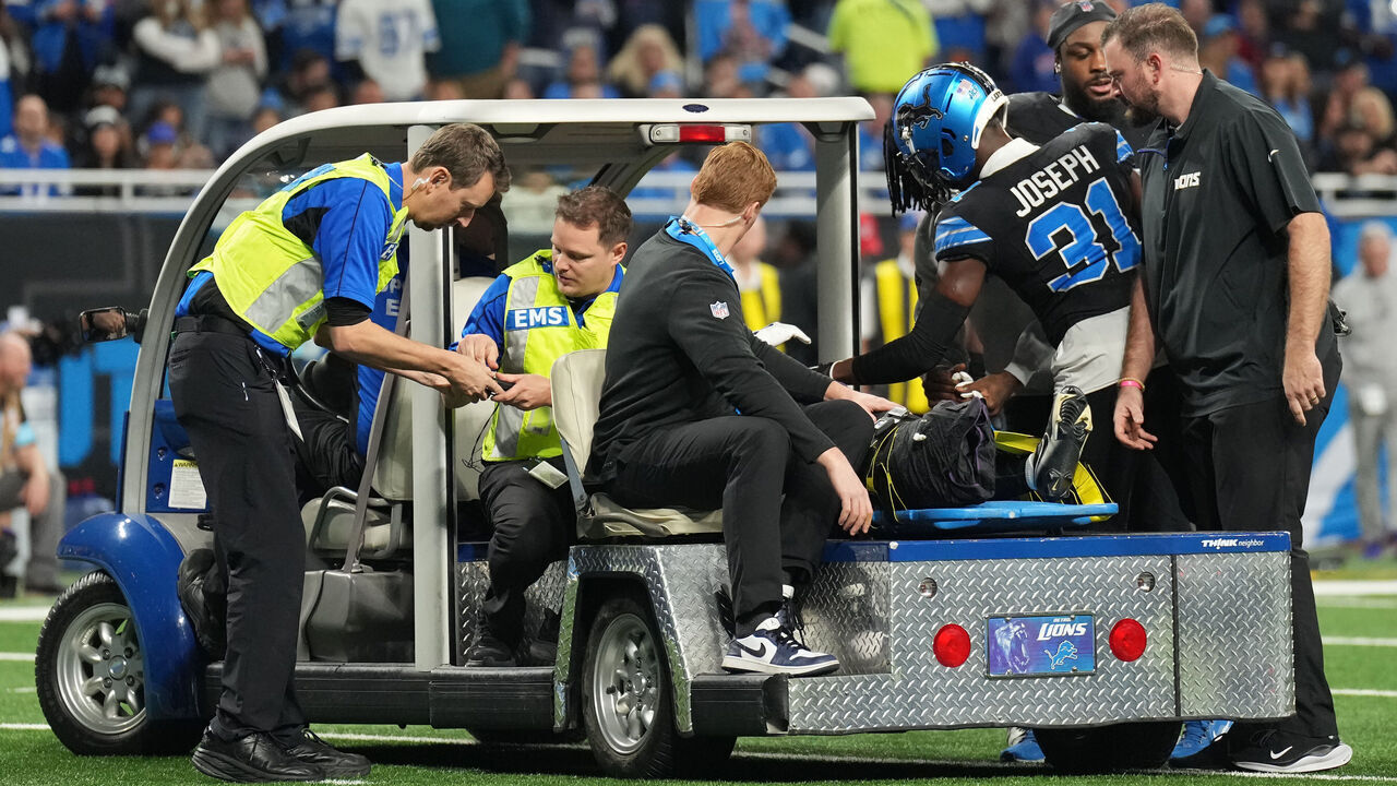 DETROIT, MICHIGAN - DECEMBER 15: Medical staff attend to Khalil Dorsey #30 of the Detroit Lions after he was injured in the second quarter against the Buffalo Bills at Ford Field on December 15, 2024 in Detroit, Michigan.