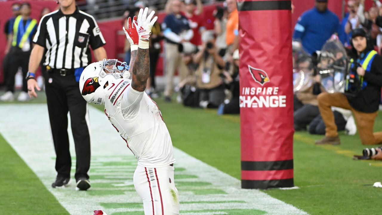 GLENDALE, ARIZONA - DECEMBER 15: James Conner #6 of the Arizona Cardinals celebrates a touchdown in the fourth quarter of the game against the New England Patriots at State Farm Stadium on December 15, 2024 in Glendale, Arizona.