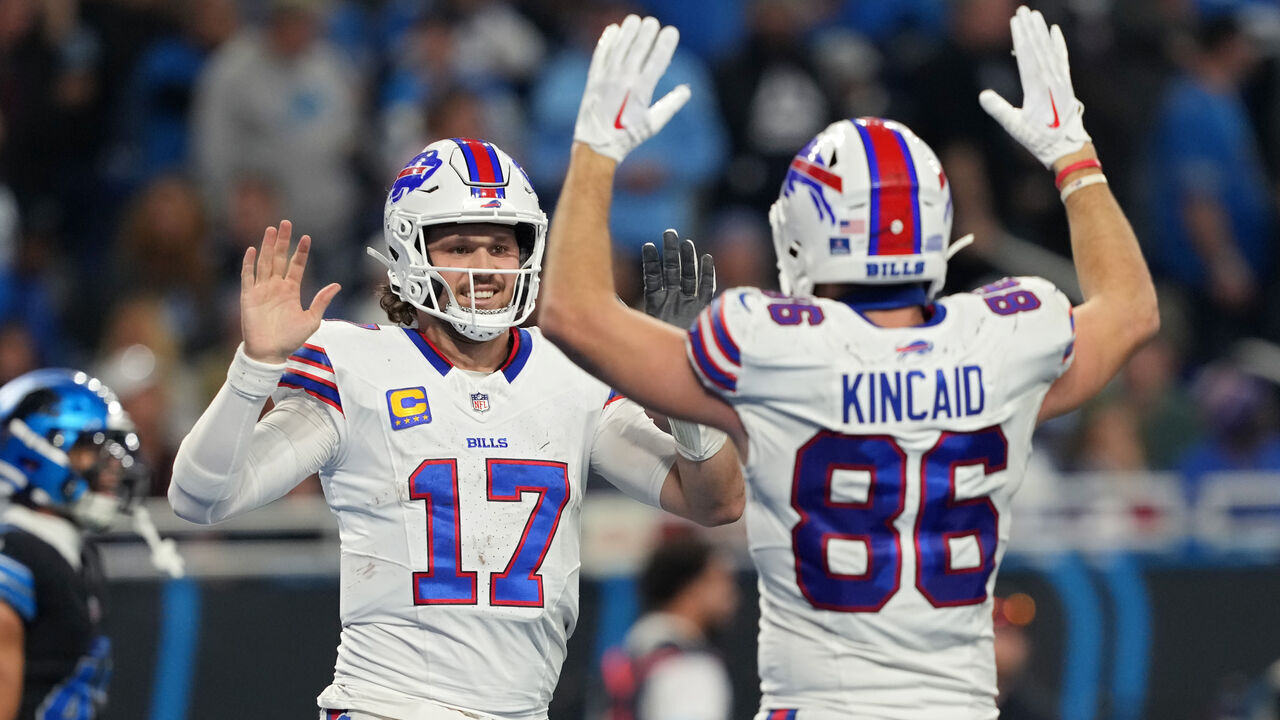 DETROIT, MICHIGAN - DECEMBER 15: Josh Allen #17 and Dalton Kincaid #86 of the Buffalo Bills celebrate after scoring a touchdown in the fourth quarter against the Detroit Lions at Ford Field on December 15, 2024 in Detroit, Michigan.