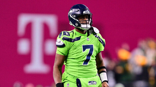 SEATTLE, WASHINGTON - DECEMBER 15: Geno Smith #7 of the Seattle Seahawks reacts after throwing an interception against the Green Bay Packers during the second quarter at Lumen Field on December 15, 2024 in Seattle, Washington.
