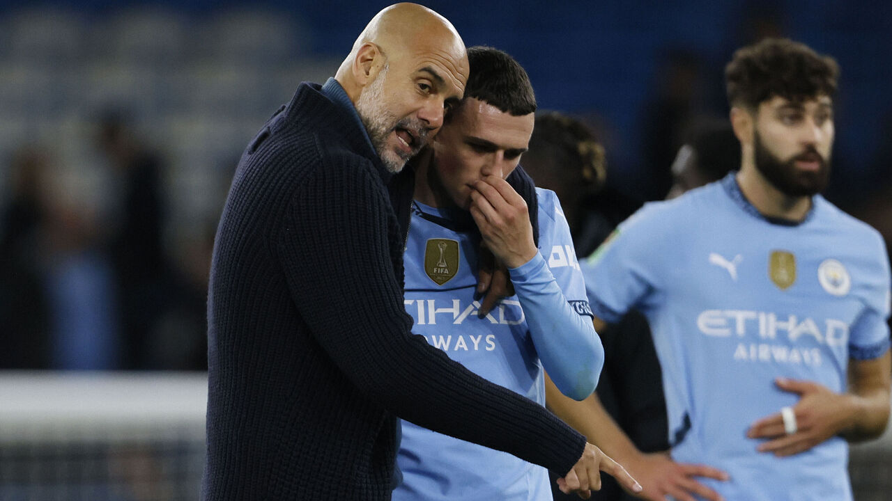 MANCHESTER, ENGLAND - SEPTEMBER 24: Phil Foden of Manchester City and Pep Guardiola, Manager of Manchester City after the Carabao Cup Third Round match between Manchester City and Watford at Etihad Stadium on September 24, 2024 in Manchester, England.
