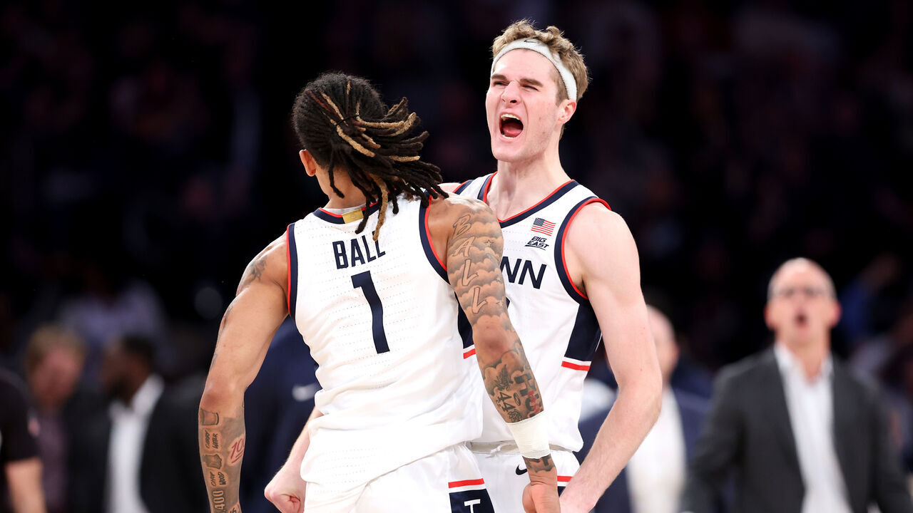 NEW YORK, NEW YORK - DECEMBER 14: Solo Ball #1 and Liam McNeeley #30 of the Connecticut Huskies react against the Gonzaga Bulldogs during the first half at Madison Square Garden on December 14, 2024 in New York City.
