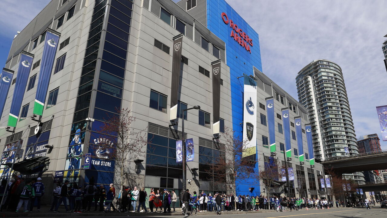 VANCOUVER, CANADA - MARCH 31: Fans line up outside Rogers Arena before the NHL game between the Anaheim Ducks and the Vancouver Canucks on March 31, 2024 in Vancouver, British Columbia, Canada.