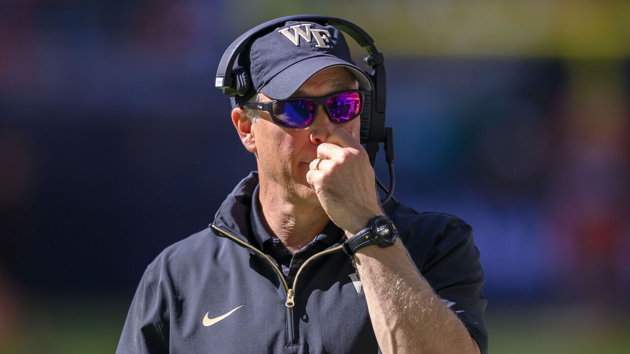 MIAMI GARDENS, FL - NOVEMBER 23: Wake Forest head coach Dave Clawson gestures on the sidelines during the college football game between the Wake Forest Deacon Demons and the University of Miami Hurricanes on November 23, 2024 at the Hard Rock Stadium in Miami Gardens, FL.