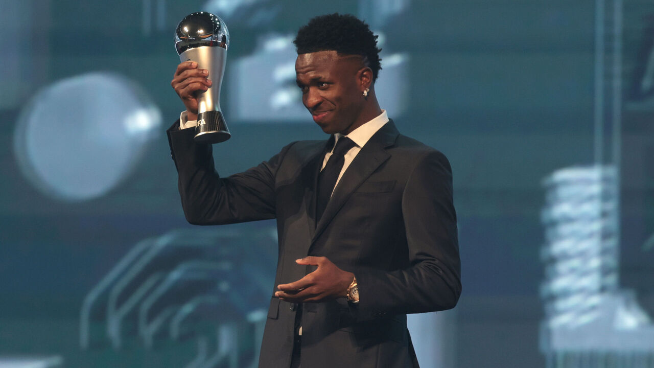 DOHA, QATAR - DECEMBER 17: Vinicius Junior of Real Madrid poses for a photo after being presented with The Best FIFA Men's Player Award during the The Best FIFA Football Awards 2024 at Aspire Academy on December 17, 2024 in Doha, Qatar.